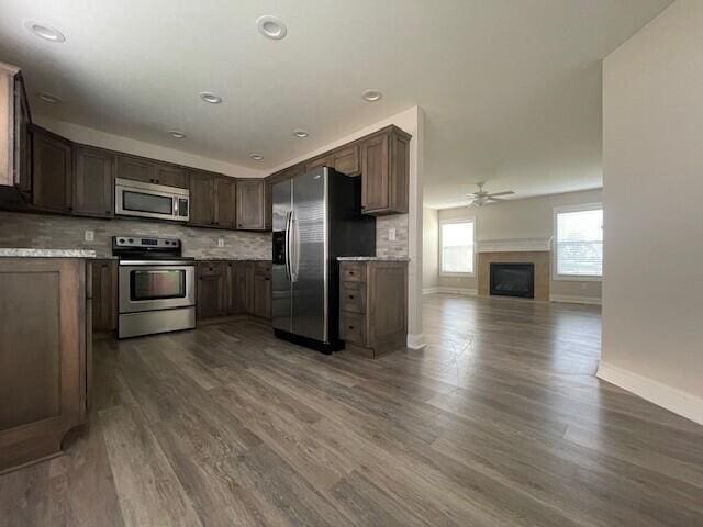 332 Bottecchia Blvd, Johnstown, OH 43031 - kitchen with stainless steel appliances, ceiling fan, open floor plan, and dark wood finished floors