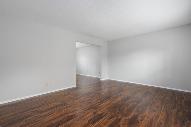 2268 Worthingwoods Blvd, Powell, OH 43065 - spare room featuring dark wood-type flooring and baseboards