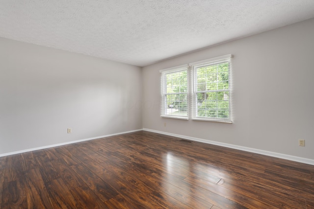 2268 Worthingwoods Blvd, Powell, OH 43065 - unfurnished room featuring dark wood finished floors and a textured ceiling