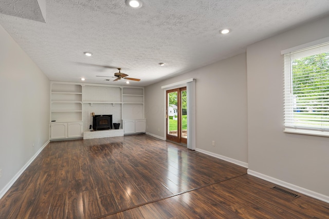 2268 Worthingwoods Blvd, Powell, OH 43065 - unfurnished living room featuring a textured ceiling, a ceiling fan, wood finished floors, recessed lighting, and a wood stove