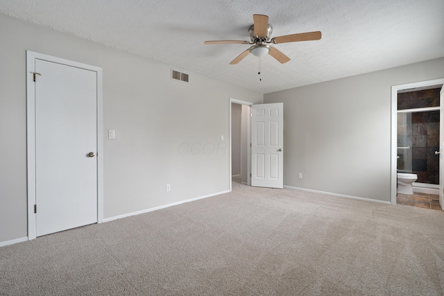 2268 Worthingwoods Blvd, Powell, OH 43065 - unfurnished bedroom with carpet flooring, a textured ceiling, connected bathroom, and a ceiling fan