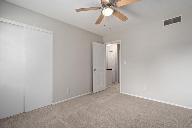 2268 Worthingwoods Blvd, Powell, OH 43065 - unfurnished bedroom featuring light carpet, a closet, and a ceiling fan