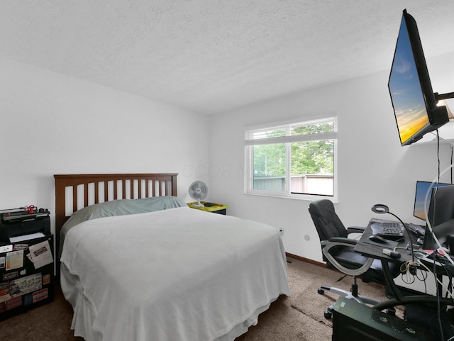 865 Westbury Ln S Unit 12B, Columbus, OH 43228 - bedroom featuring carpet, a textured ceiling, and an office area