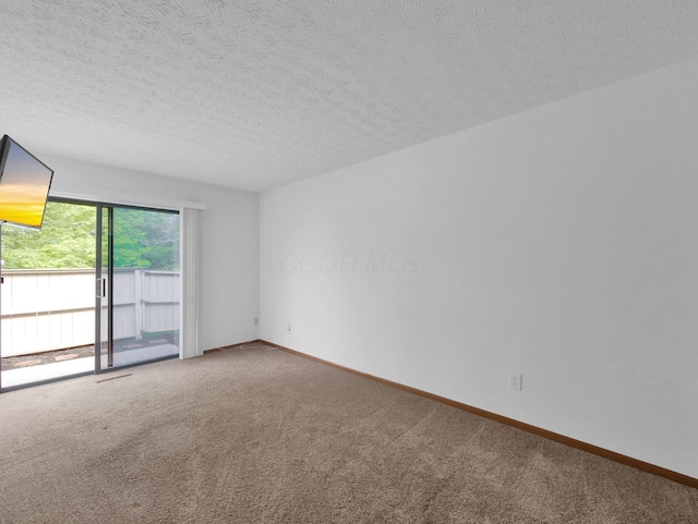 865 Westbury Ln S Unit 12B, Columbus, OH 43228 - empty room with carpet and a textured ceiling