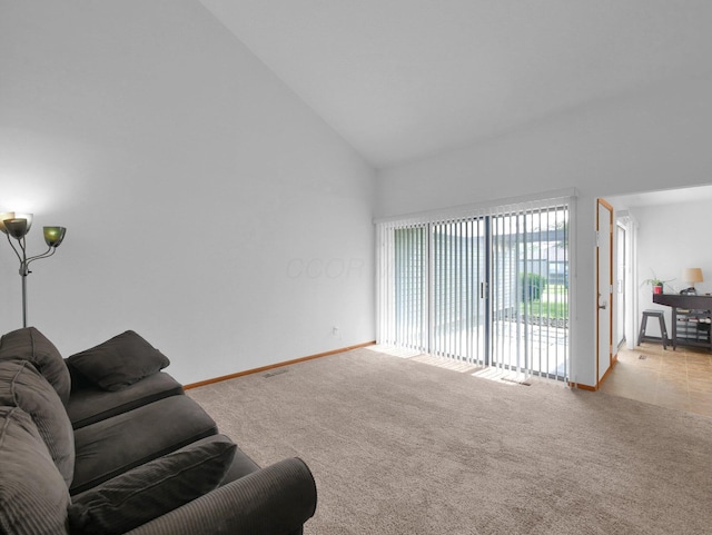 865 Westbury Ln S Unit 12B, Columbus, OH 43228 - carpeted living area featuring high vaulted ceiling and baseboards