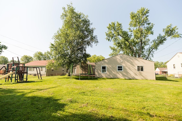 1840 N Columbus St, Lancaster, OH 43130 - view of grassy yard with a trampoline and a playground