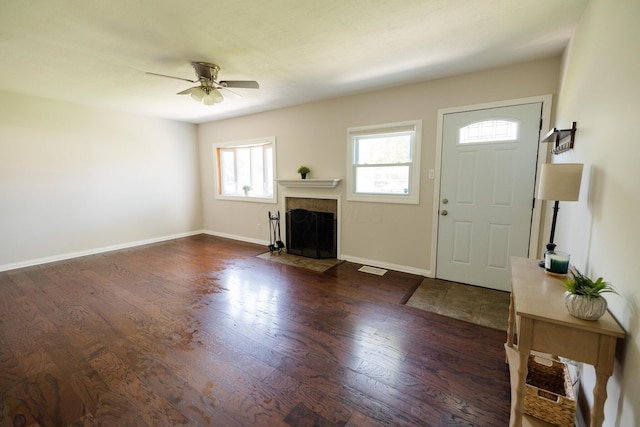 1840 N Columbus St, Lancaster, OH 43130 - foyer entrance featuring wood finished floors, healthy amount of natural light, a ceiling fan, and a fireplace with flush hearth