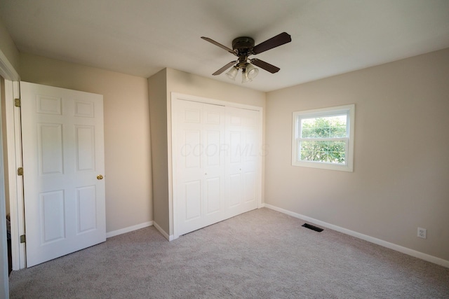 1840 N Columbus St, Lancaster, OH 43130 - unfurnished bedroom with carpet, a closet, and ceiling fan