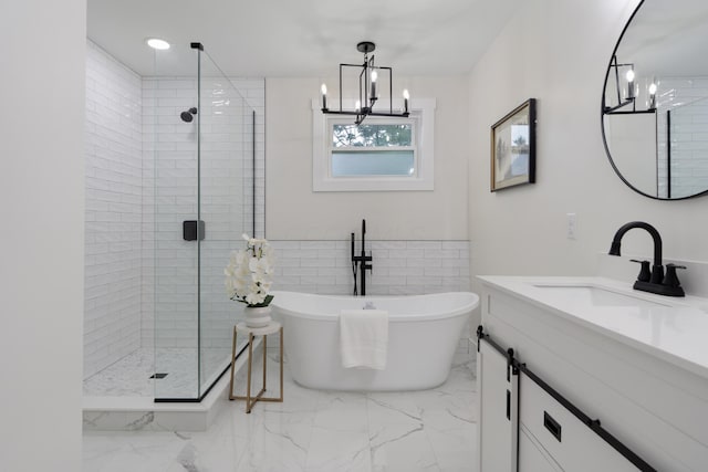 1591 Franklin Ave, Columbus, OH 43205 - bathroom with marble finish flooring, a stall shower, vanity, and a freestanding bath