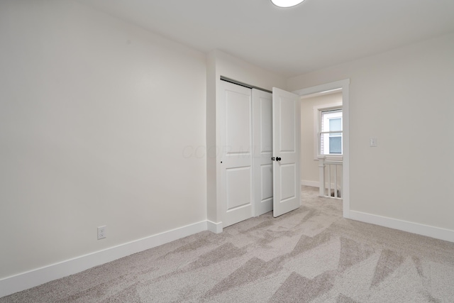 1591 Franklin Ave, Columbus, OH 43205 - unfurnished bedroom featuring light colored carpet and a closet