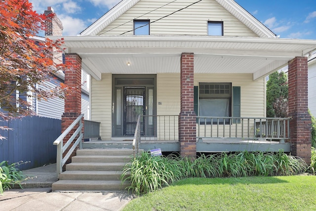 649 E 11th Ave, Columbus, OH 43211 - view of front facade featuring a porch