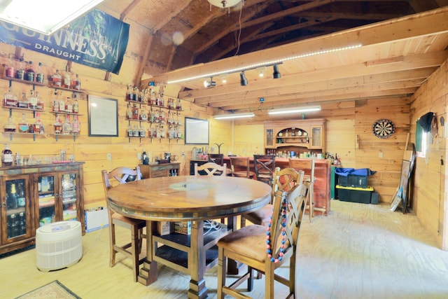 120 Hickory Ln, Lancaster, OH 43130 - dining area with wood walls, lofted ceiling, and wood finished floors