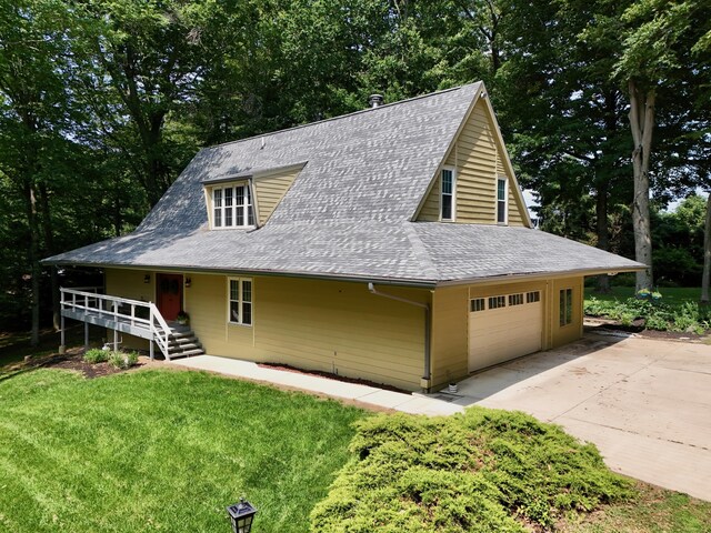 120 Hickory Ln, Lancaster, OH 43130 - view of front facade with driveway, a shingled roof, a garage, a front yard, and view of wooded area