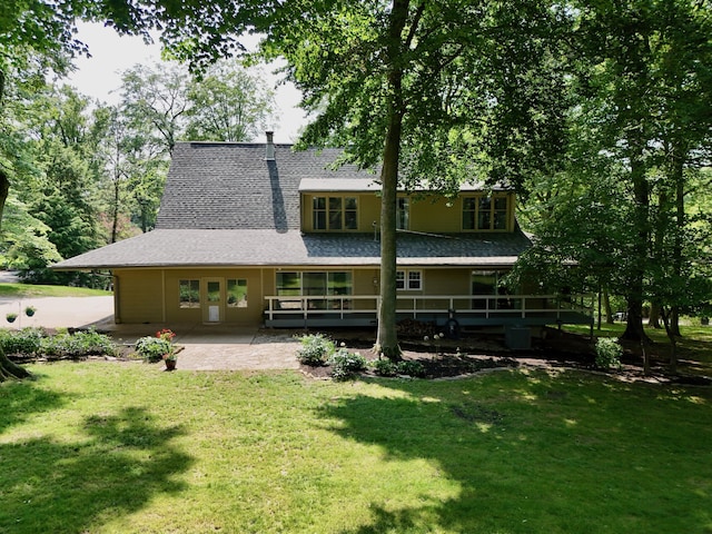 120 Hickory Ln, Lancaster, OH 43130 - back of house featuring a lawn, a patio area, and a shingled roof