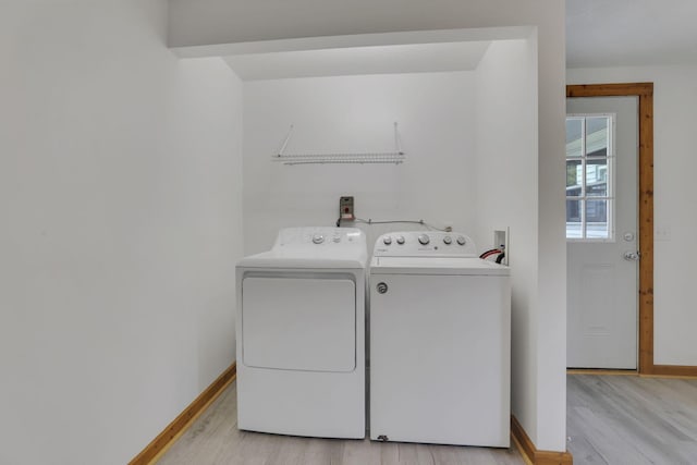 6228 Patton Rd NE, Newark, OH 43055 - washroom featuring washer and clothes dryer and light wood finished floors