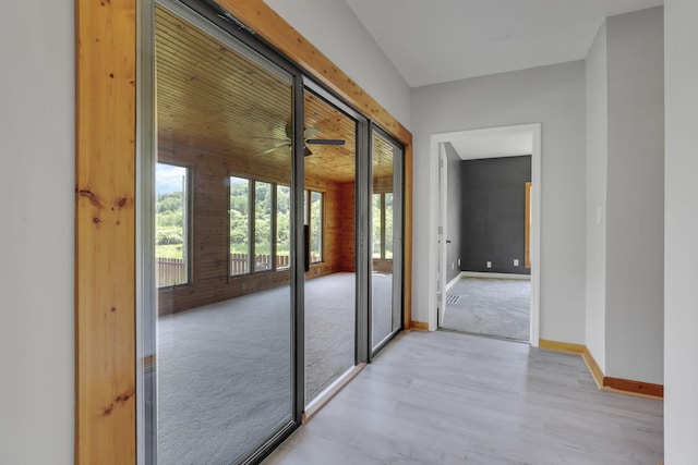 6228 Patton Rd NE, Newark, OH 43055 - doorway featuring light wood-style floors, ceiling fan, and light carpet