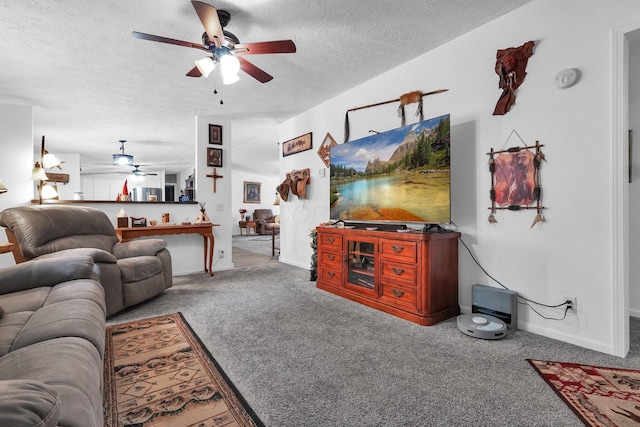 562 Bowman Ln, Chillicothe, OH 45601 - carpeted living room with ceiling fan and a textured ceiling