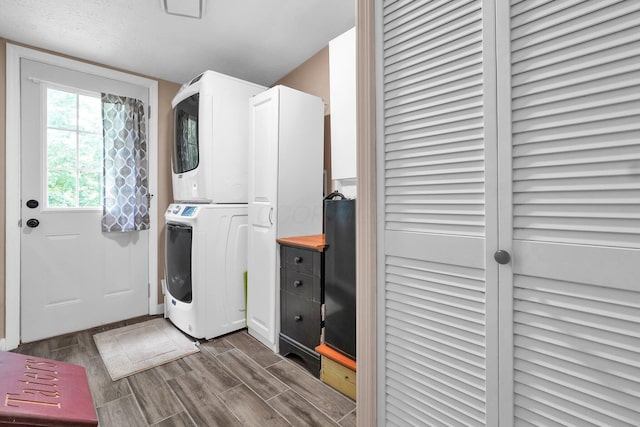 562 Bowman Ln, Chillicothe, OH 45601 - washroom with stacked washer / drying machine and wood tiled floors