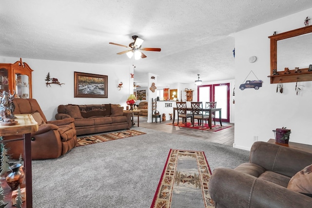 562 Bowman Ln, Chillicothe, OH 45601 - carpeted living area with a textured ceiling and ceiling fan
