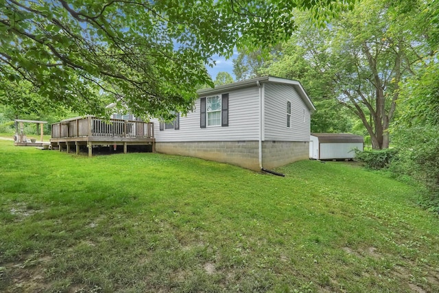 562 Bowman Ln, Chillicothe, OH 45601 - rear view of house with a storage shed, a deck, a lawn, and crawl space