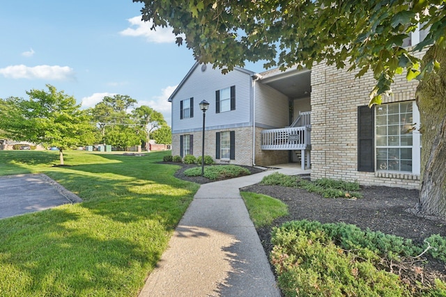 2082 Park Run Dr Unit A, Columbus, OH 43220 - view of side of home with a lawn and brick siding