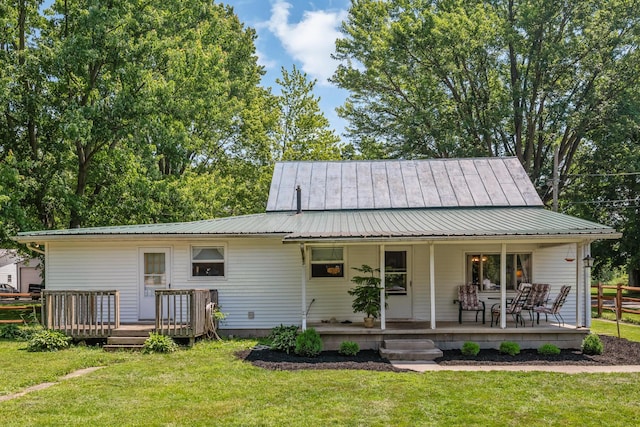 247 3rd St, La Rue, OH 43332 - view of front of house with covered porch, a metal roof, and a standing seam roof