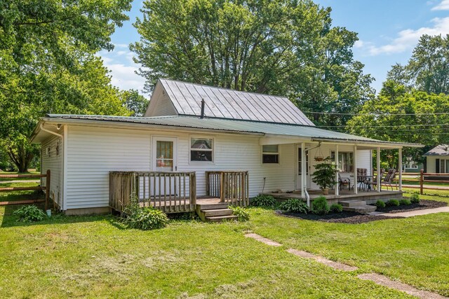 247 3rd St, La Rue, OH 43332 - rear view of property featuring a metal roof