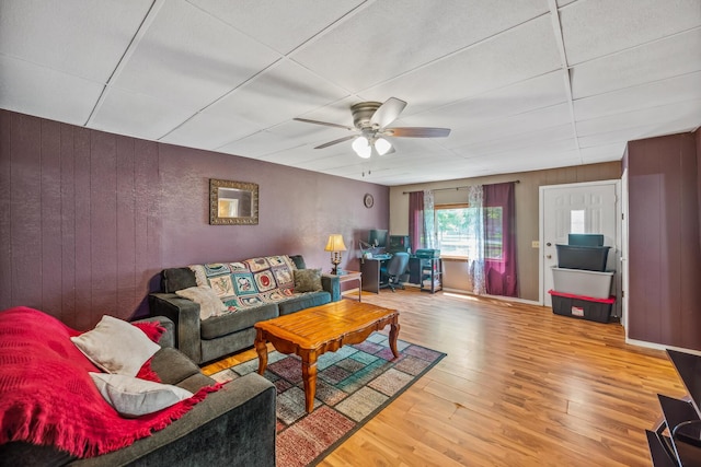 247 3rd St, La Rue, OH 43332 - living room with wood finished floors, a ceiling fan, and wooden walls
