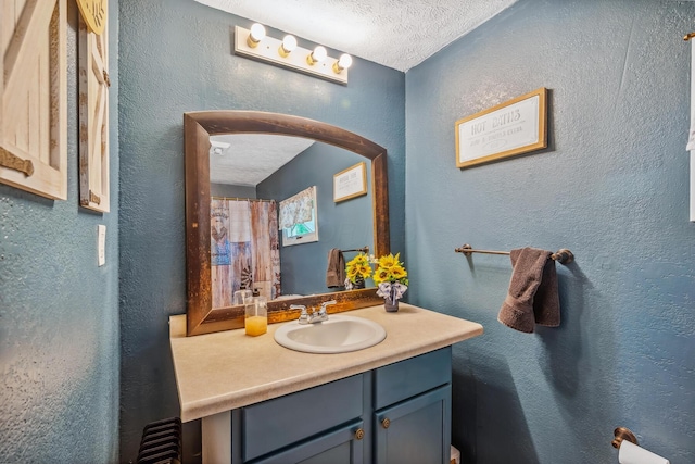 247 3rd St, La Rue, OH 43332 - bathroom featuring vanity, a textured ceiling, and a textured wall