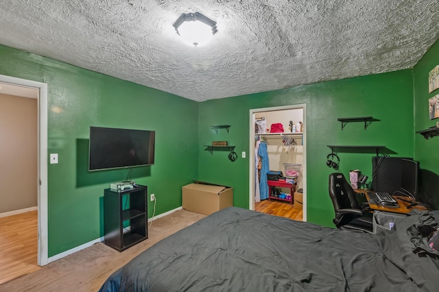 247 3rd St, La Rue, OH 43332 - bedroom featuring a textured ceiling and a closet