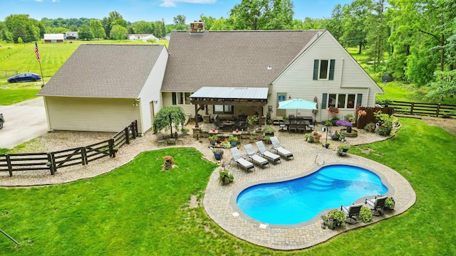 8384 Morris Rd, Hilliard, OH 43026 - rear view of house with a patio, a fenced backyard, and a chimney
