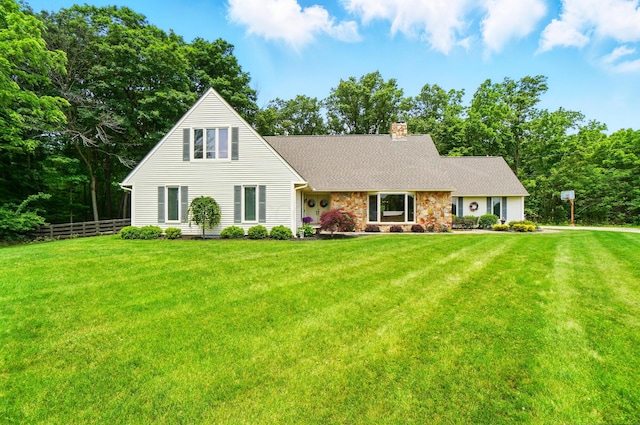 8384 Morris Rd, Hilliard, OH 43026 - view of front of home with a chimney, roof with shingles, and stone siding