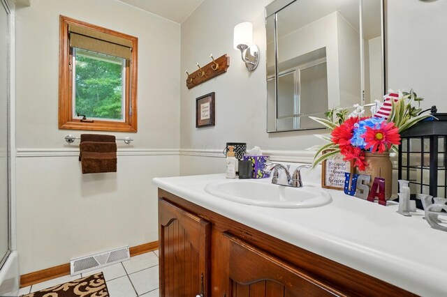 8384 Morris Rd, Hilliard, OH 43026 - bathroom featuring a shower with door, vanity, and tile patterned floors