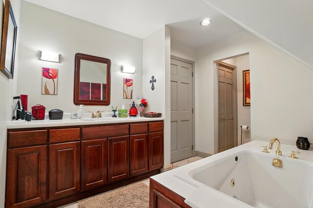 8384 Morris Rd, Hilliard, OH 43026 - full bathroom featuring vanity, a tub with jets, and recessed lighting