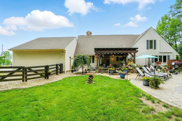 8384 Morris Rd, Hilliard, OH 43026 - rear view of house featuring a pergola, a patio area, a fenced backyard, and a chimney