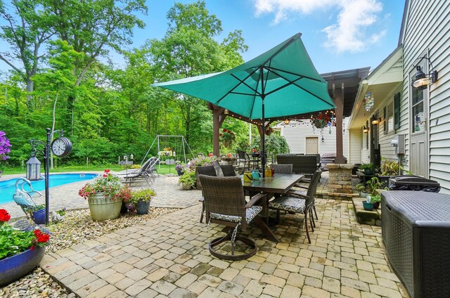 8384 Morris Rd, Hilliard, OH 43026 - view of patio / terrace featuring outdoor dining area and an outdoor pool