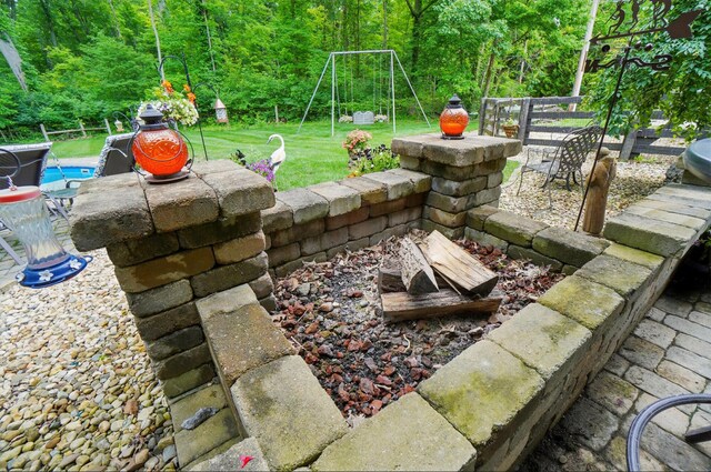 8384 Morris Rd, Hilliard, OH 43026 - view of patio / terrace featuring a playground, a view of trees, and a pool