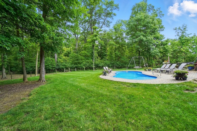 8384 Morris Rd, Hilliard, OH 43026 - outdoor pool featuring a patio area, a yard, and a view of trees