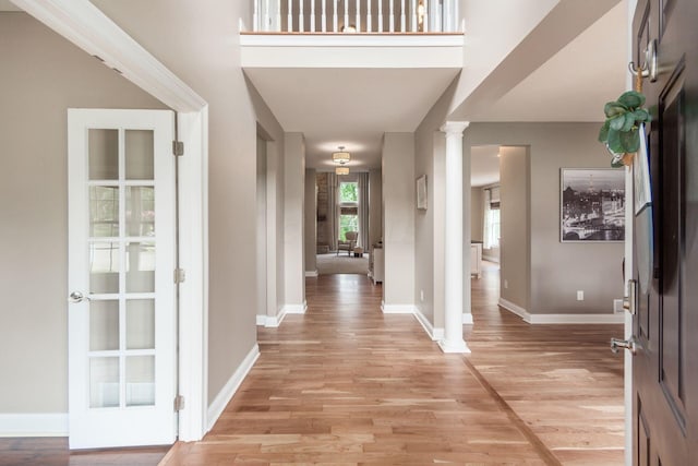 2467 Roe Dr, Lewis Center, OH 43035 - entrance foyer featuring ornate columns and light wood finished floors