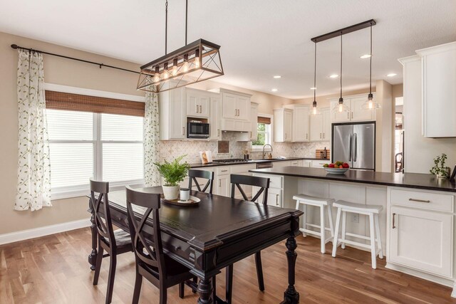 2467 Roe Dr, Lewis Center, OH 43035 - dining room with wood finished floors and recessed lighting
