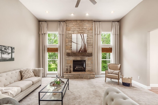 2467 Roe Dr, Lewis Center, OH 43035 - living room with healthy amount of natural light, a ceiling fan, carpet floors, a fireplace, and recessed lighting