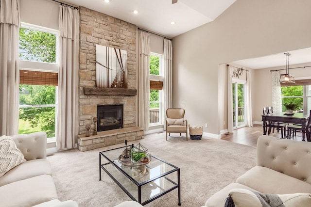 2467 Roe Dr, Lewis Center, OH 43035 - carpeted living area featuring a fireplace, recessed lighting, and ceiling fan