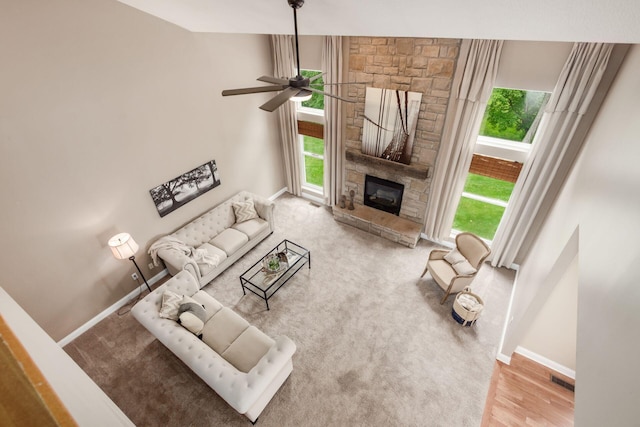 2467 Roe Dr, Lewis Center, OH 43035 - living area with a ceiling fan and a fireplace
