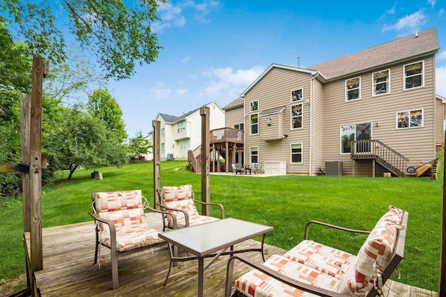 2467 Roe Dr, Lewis Center, OH 43035 - back of house with stairway, a deck, a patio area, and a lawn