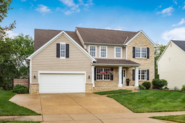 2467 Roe Dr, Lewis Center, OH 43035 - view of front of house featuring stone siding, concrete driveway, a shingled roof, and an attached garage