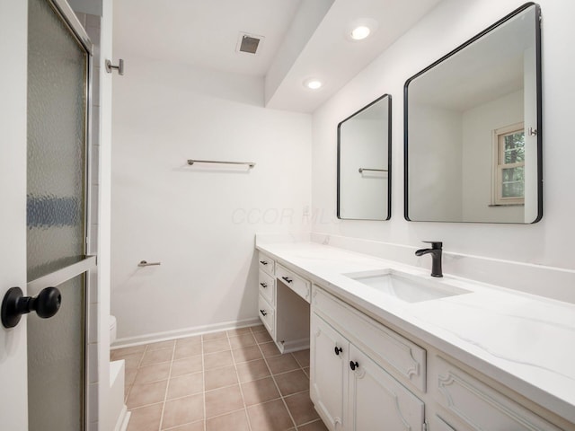 6509 Evening St, Worthington, OH 43085 - full bath featuring vanity, recessed lighting, an enclosed shower, and tile patterned flooring