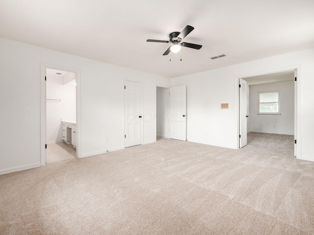 6509 Evening St, Worthington, OH 43085 - unfurnished bedroom featuring light carpet, connected bathroom, and ceiling fan