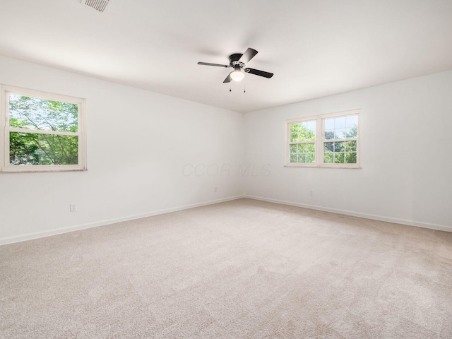 6509 Evening St, Worthington, OH 43085 - spare room featuring healthy amount of natural light, a ceiling fan, and light colored carpet