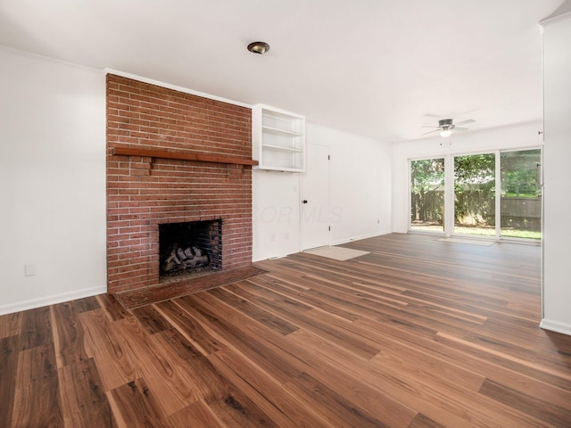 6509 Evening St, Worthington, OH 43085 - unfurnished living room featuring a ceiling fan, a fireplace, and wood finished floors