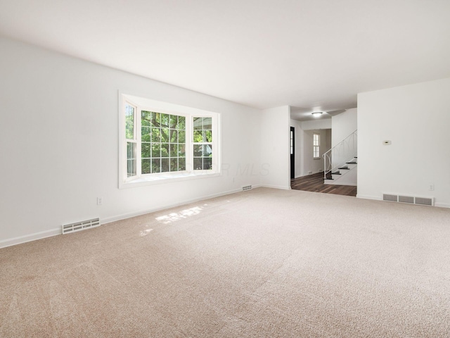 6509 Evening St, Worthington, OH 43085 - unfurnished living room with carpet and stairs